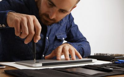 professional-unscrewing-case-metallic-slim-laptop-his-electric-service-lab-clean-repair-it