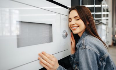 young-woman-selected-new-microwave-oven-hypermarket